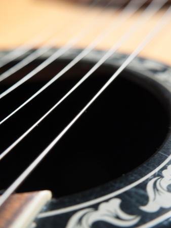 Closeup image of standard six string guitar. Selective focus