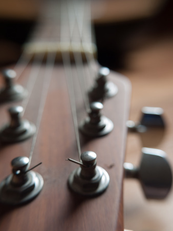 Closeup image of standard six string guitar. Selective focus