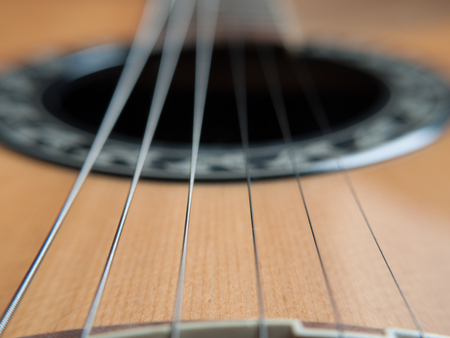 Closeup image of standard six string guitar. Selective focus