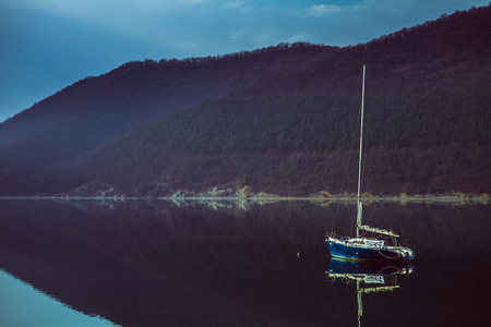 The yacht on the lake in the calmの写真素材