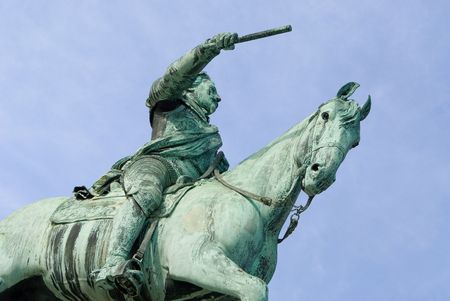 a statue of a leader riding on a horse pointing with a stickの写真素材