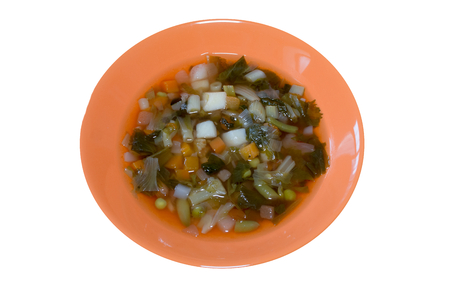 Plate with soup on a wooden tableの写真素材