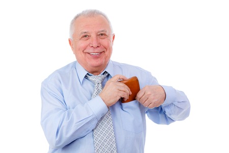 Handsome mature businessman puts the purse in his pocket. isolated over white backgroundの写真素材