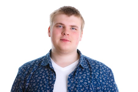 Closeup portrait of happy confident smiling young man in 2025 years in shirt looking at camera isolated on white background. Positive human emotionの写真素材