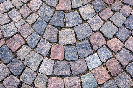 Background old granite paving stones in old townの写真素材