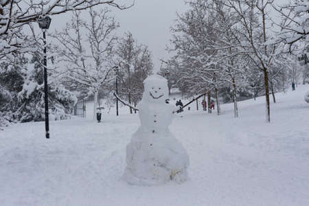 Streets and parks of Madrid covered with snow. Cold winter. Big snowfall in the city