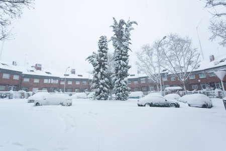 Streets and parks of Madrid covered with snow. Cold winter. Big snowfall in the city