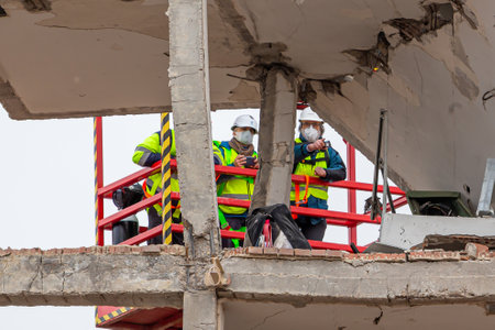 Madrid, Spain- January 21, 2021: Technicians from the Madrid City Council inspect the consequences of the gas explosion in a building.のeditorial素材