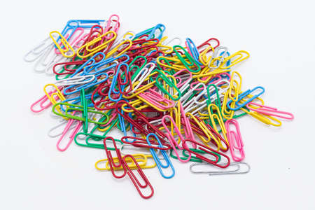 Colored clips on white background. Product photo. Office supplies.