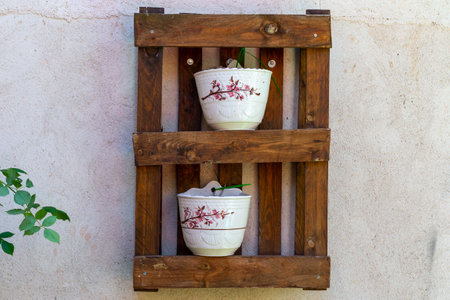 Old wooden shelf with porcelain bowls. Interior decoration. Exterior decoration.の写真素材