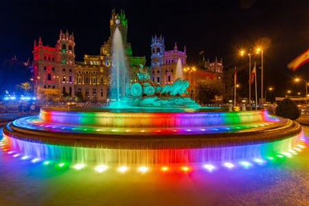 Madrid, Spain: Plaza de Cibeles illuminated with the colors of the rainbow during the gay pride festivities. Pride festivals in Madridのeditorial素材