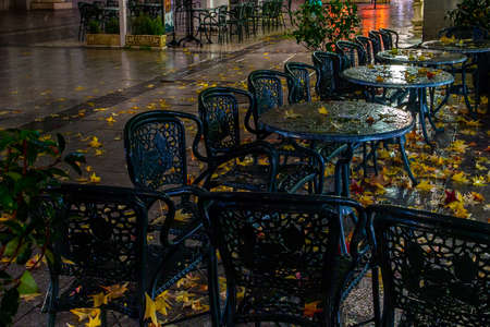 Night photography of the terraces in the Plaza de Oriente in Madrid covered in autumn leaves.の写真素材
