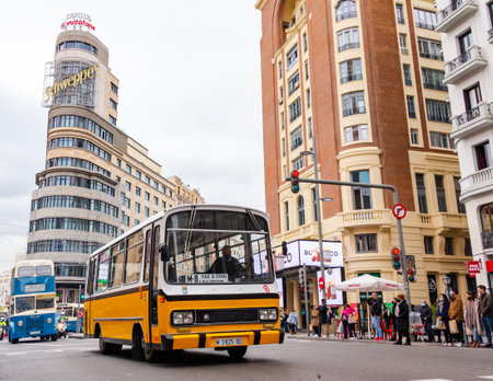 Madrid, Spain- December 19,2021: The transport company of the Community of Madrid, EMT, celebrates its 75th anniversary in exhibiting in the streets of Madrid, the most emblematic and oldest busesのeditorial素材