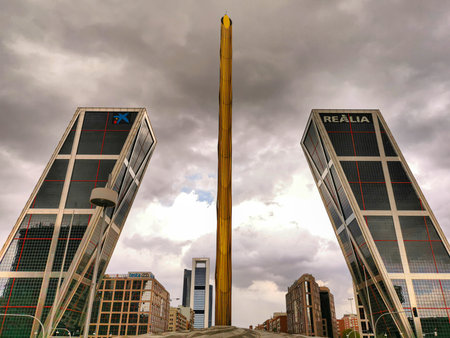 Madrid, Spain- April 13, 2022: Torres Kio in Plaza de Castilla in Madrid on a stormy day with gray clouds.のeditorial素材