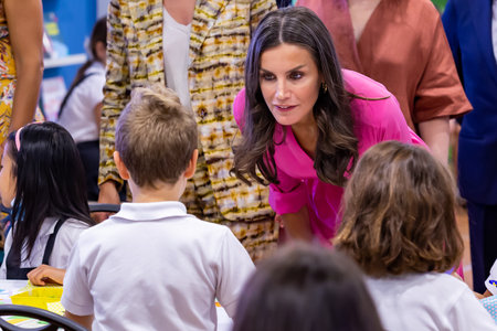 Madrid, Spain 27, 2022: The Queen of Spain, DoÃ±a Leticia inaugurates the Book Fair in the Retiro Park in Madrid. She visits a craft workshop at the Book Fair where she is interested in the printing prのeditorial素材