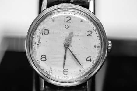 Macro photo of a men's watch. Clock hands. An antique clock. Black and white photos. Time signals. Wrist watch.の写真素材
