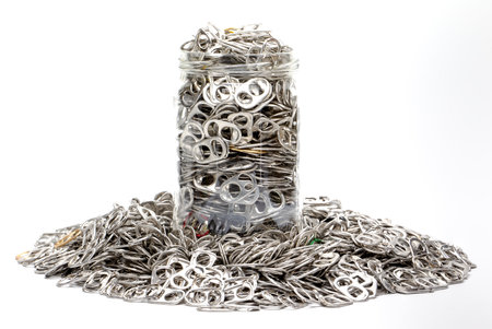 Glass jar filled with metal sheets. Recycling bin. Metal can sheets. Environmental Protection. Metal...