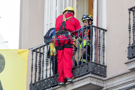 Madrid, Spain- November 25, 2022: Greenpeace demonstrates in Plaza de Callao in Madrid against Black Friday. Police evict Greenpeace activists.のeditorial素材