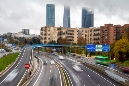 View of the 4 Towers with fog and road junction in Madrid. Rainy and foggy day over Madrid. Cityscape.の写真素材
