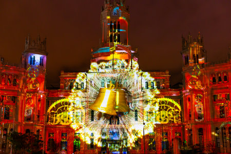 Madrid, Spain- December 17, 2022: Video mapping projected on the facade of the Palacio de Correos in Madrid on the occasion of Christmas. Light show in Madrid. Christmas projectionのeditorial素材