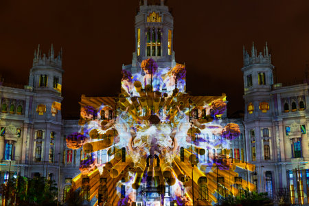 Madrid, Spain- December 17, 2022: Video mapping projected on the facade of the Palacio de Correos in...