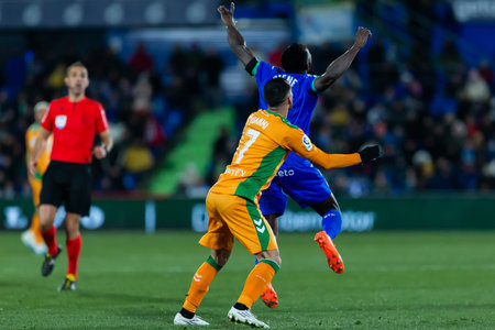 Madrid, Spain- January 28, 2023: Soccer match between Real Betis and Getafe FC in Madrid. Football players. Ball sports.のeditorial素材