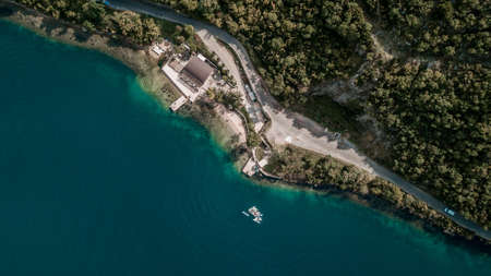 Aerial view of group of people with SUP Stand up paddle boards in blue water of  Kotor bay (Boka Kotorska), Montenegro, Europeの写真素材