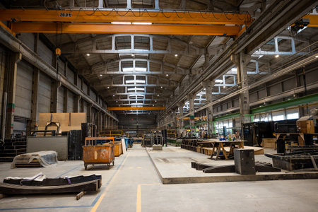 The interior of a big industrial building or factory with steel and concrete constructionsの写真素材