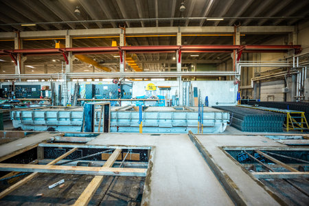 The interior of a big industrial building or factory with steel and concrete constructionsの写真素材