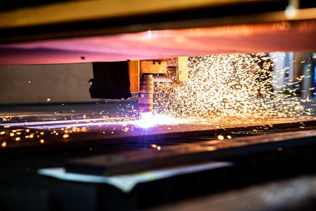 Sparks of plasma cutting machine, thick metal cutting, metal cut process, carpentry metalwork industryの写真素材