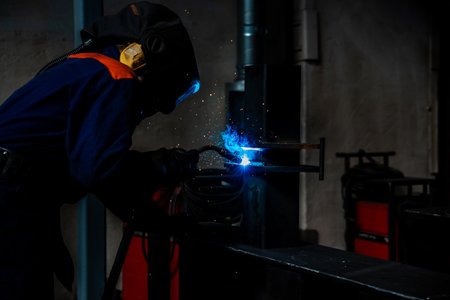 welder and welding sparks, construction and metal work industrial concept, metal welding with sparksの写真素材