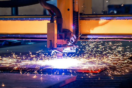 Sparks of plasma cutting machine, thick metal cutting, metal cut process, carpentry metalwork industryの写真素材