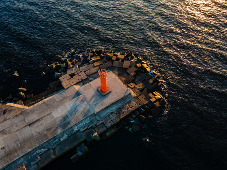 Aerial drone view of a breakwater and a lighthouse in Riga, Latvia