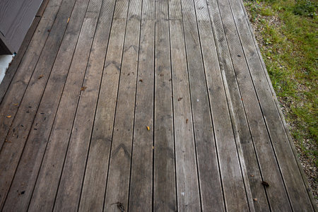 Weathered wooden deck, terrace with algae and moss, spring cleaning in garden and yardの写真素材