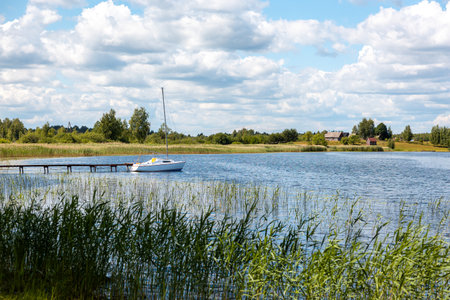 Sailing boat at the pier in the lakeの写真素材