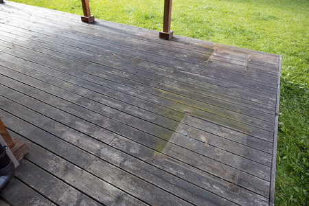Weathered wooden deck, terrace with algae and moss, spring cleaning in garden and yardの写真素材