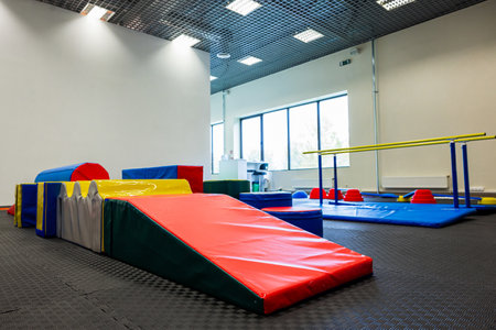 Colorful Gymnastic Equipment in Modern Training Room Kid's Physical Development Zoneの写真素材
