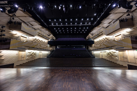 Elegant Contemporary Auditorium with Advanced Lighting and Spacious Wooden Floorの写真素材