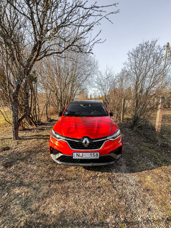 Riga, Latvia - 01.10.2023: Arkana RS-line is a compact crossover SUV E-tech hybrid car.の写真素材