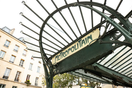 parisian metropolitain entrance with iconic art nouveau design and city map, a blend of functionality and historical artistryの写真素材
