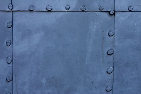 Blue metal plate with rivetsの写真素材