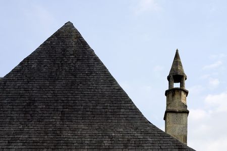 Tiled roof and chimney in Franceの写真素材