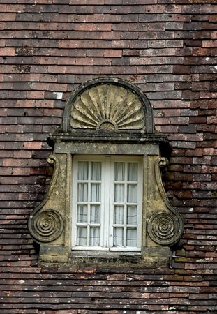 Ancient window and roof in Dordogne, Franceの写真素材