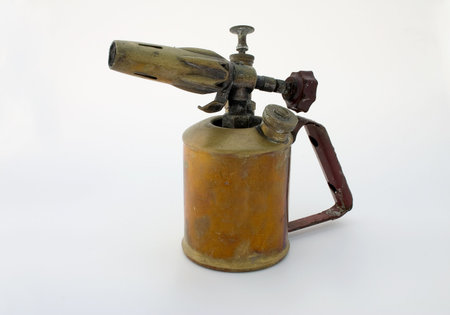 Old brass blowtorch, isolatedの写真素材
