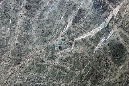 Close-up of a rough green marble wall