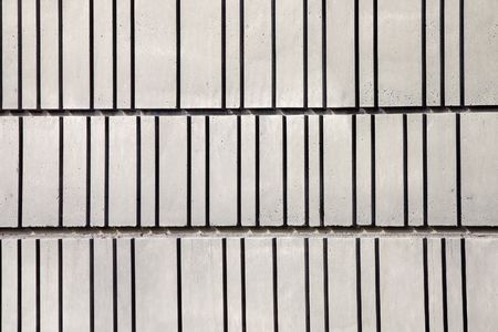 Close-up of a concrete wall decorated with linesの写真素材