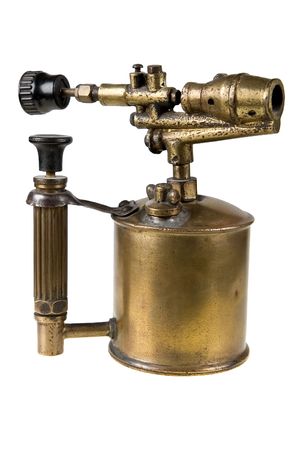 An ancient brass blowtorch isolated on whiteの写真素材