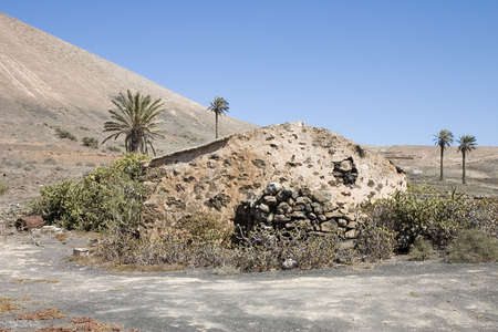 Rustic house in an arid landscape in Lanzarote, Canary Islands, Spainの写真素材
