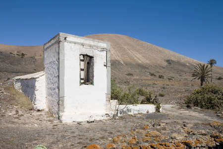 Rustic house in an arid landscape in Lanzarote, Canary Islands, Spainの写真素材