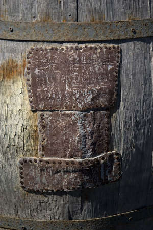Detail of an old patched wine barrelの写真素材